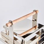 Close-up of smooth natural teak handle attached to polished chrome lantern frame