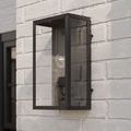 Royster Outdoor Wall Sconce mounted on white brick exterior wall, side angled view