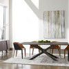 Table styled with mixed black and brown leather dining chairs in sunlit modern dining room