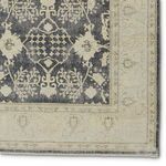 Close-up of navy medallion and cream border pattern with intricate detailing on Pia Medallion rug
