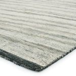 Close-up of Farrow rug corner showing detailed hand-knotted texture and dark gray border