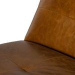 Close-up on the center seat area showing stitched panel details and luxurious leather