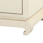 Close-up of the delicate curved Chow-style base of the cabinet