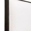 Close-up of lower corner framing near footboard showing dark oak wood finish and base support
