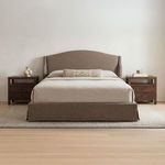 Styled Weston Storage Bed in bedroom setting with neutral bedding, decorative bolster pillow, wood nightstands