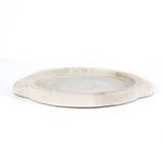Rear angled view emphasizing carved handle shape and broad flat base of the tray