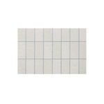Top-down close-up showing the clean, smooth surface of the white grid-patterned glazed concrete top