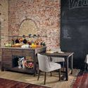Two Lewis Windsor Bar + Counter Stools styled in a modern kitchen with wood island and white marble countertop
