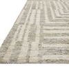 Low angled view showing thickness and edge of Yeshaia Oatmeal Silver Rug with pattern extending over edge
