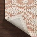 Yeshaia Terracotta / Ivory Rug corner flipped up revealing woven backing and edge binding
