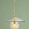 Ressi Pendant front view centered on green wall with lit bulb inside frosted globe