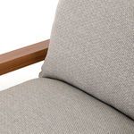 Detailed view of back cushion and seat fabric junction on Soren Outdoor Chair with wide teak armrest