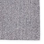 Detailed close-up highlighting the herringbone-like woven pattern of black and white fibers