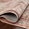 Detailed close-up of rolled edge of rug revealing backside texture and thickness