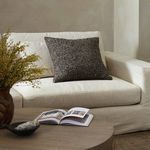 Callum Pillow styled on light beige sofa in neutral living room with wooden coffee table