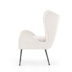 Profile side view showing the chair’s gently sloping backrest and seat with black metal legs