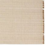Close-up detail of fine, linear woven pattern in cream and beige tones