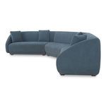 Side angle view highlighting the rounded sloped arm and plush cushions on the blue sectional