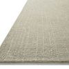 Angled view of Polly Spa rug edge showing low profile and grid pattern texture