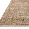 Close-up angled view showing pile texture and woven detailing along the Heritage Clay rug edge
