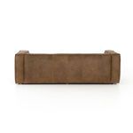 Straight back view of the sofa with visible paneling and neat stitching in natural leather.