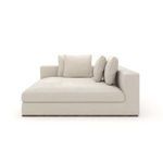Left-side view highlighting the chaise seat cushion and three pillows against the armrest