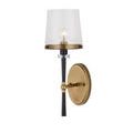 Lyndall Wall Sconce with short tapered black stem and clear glass shade from angled perspective