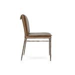 Side view of brown leather dining chair showing chair profile and slim iron legs