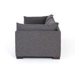 Side profile of Westwood sectional showing gently sloping back cushions and solid armrest