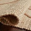 Rolled edge of the Bodhi Ivory rug showing thick jute weave and texture