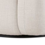 Close-up showing base seam and fabric texture above black swivel plate