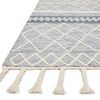 Close-up of Sawyer Teal Rug corner showing twisted cream fringe and hand-loomed texture