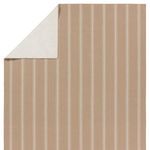 Rug corner flipped to reveal solid ivory underside fabric
