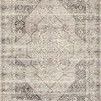 Ivory Mika Stone rug with abstract tribal-inspired medallion pattern in muted gray and beige tones