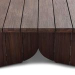 Close-up of curved cut detail at base between vertical teak panels on Joette Outdoor Coffee Table