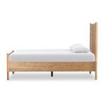 Lifestyle shot of toasted sungkai king bed styled in rustic bedroom with side tables and decor