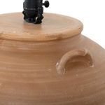 Partial view of terracotta base showing rounded handle detail near neck and lamp socket hardware