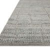 Close-up low-angle view showing the rug’s textured surface and edge detail