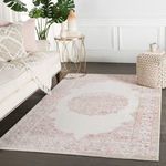 Styled living room with Malo Medallion rug under sofa, gold side table and white wall