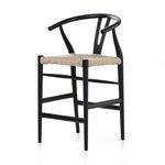 Back view of black teak frame and woven seat with center V-shaped back support