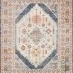 Clara Pebble / Fiesta Rug with vintage style, soft muted colors, and a central medallion design framed by detailed borders