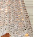 Close-up showing woven texture and light peeking through the whitewashed seagrass shade