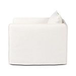 Left front view of chair with visible looseness in cushion slipcovers
