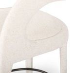 Close-up of the smooth rounded backrest to seat transition with fabric texture visible.