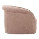Side view of Rosy Sofa highlighting rounded backrest and soft fabric texture