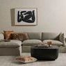 End table shown in a living room setting with vase, candle, and rug as styling elements
