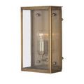 View of black Royster Outdoor Wall Sconce with lit bulbs and seeded glass next to a textured doorway