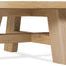 Round Driftwood cocktail table with warm Buckboard finish, X-stretcher base, oak solids and veneers