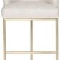 Charley Barrel Base Stool with barrel-shaped cream fabric seat and warm brass-finished base with open frame