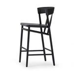 View of the underside seat frame and front leg connection with footrest of the Buxton Drifted Oak Bar Stool